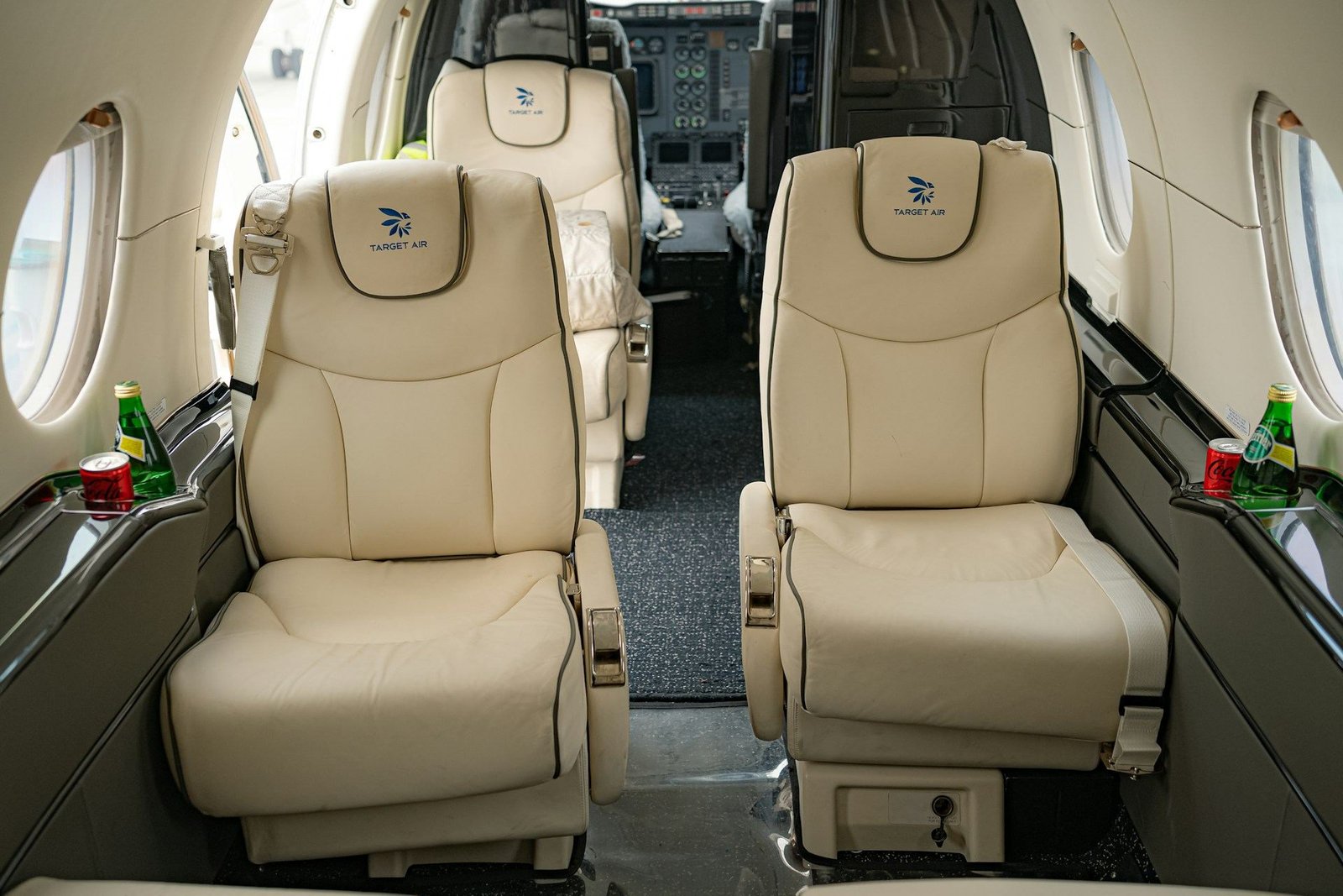 Cream leather seats in the cabin of a private jet