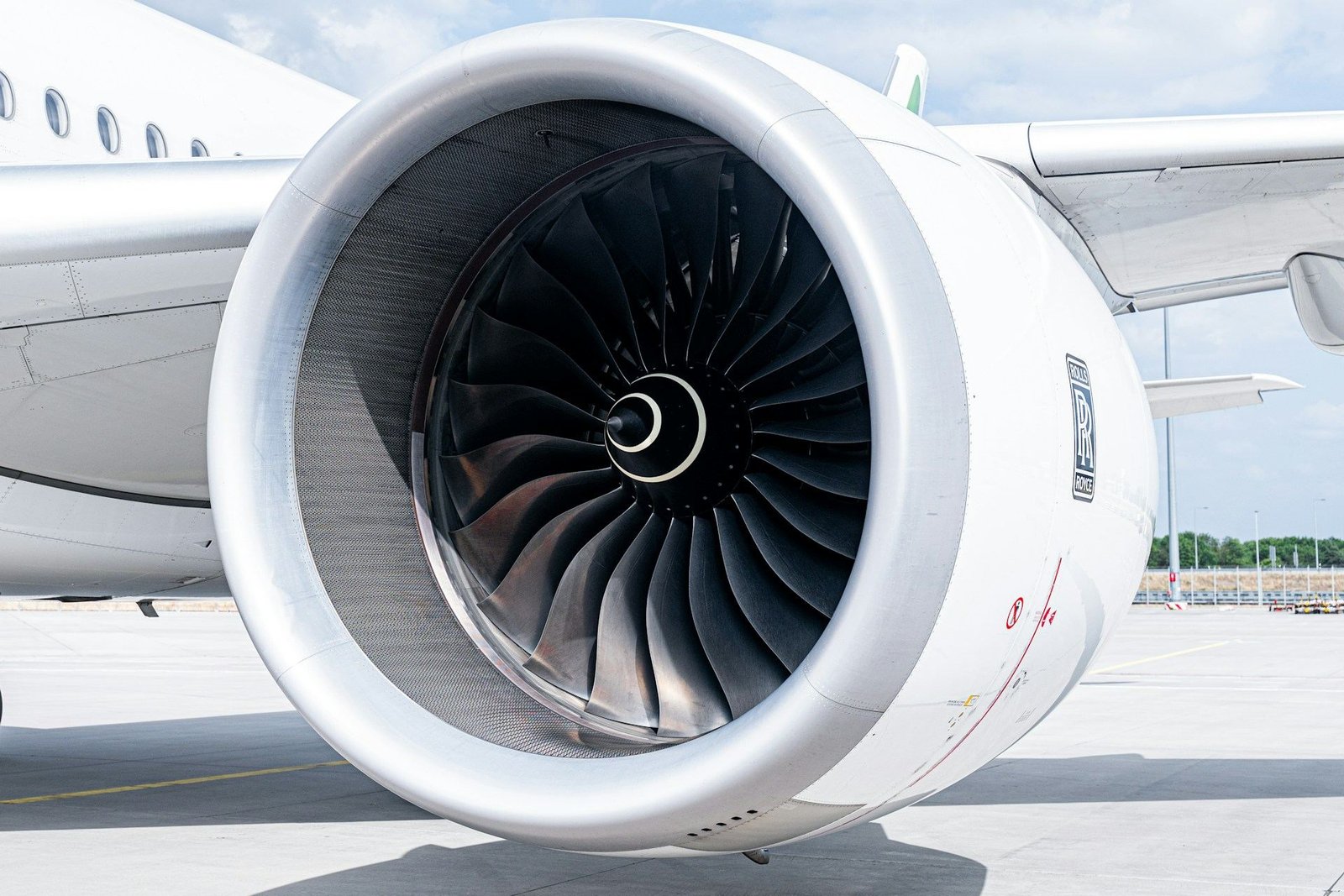 Close-up of a jet engine on an aircraft parked on the apron
