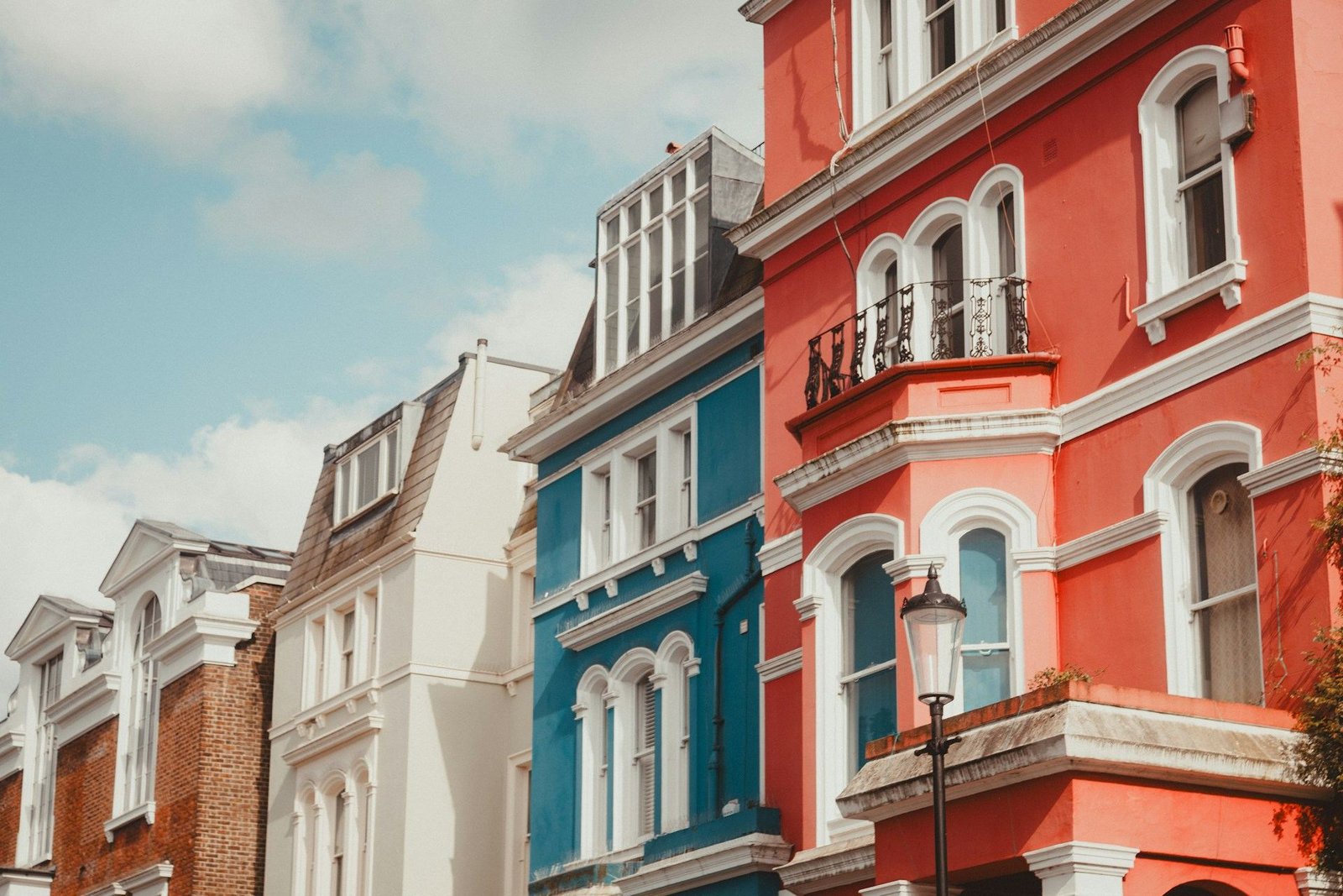 Brightly painted red, blue and white townhouses