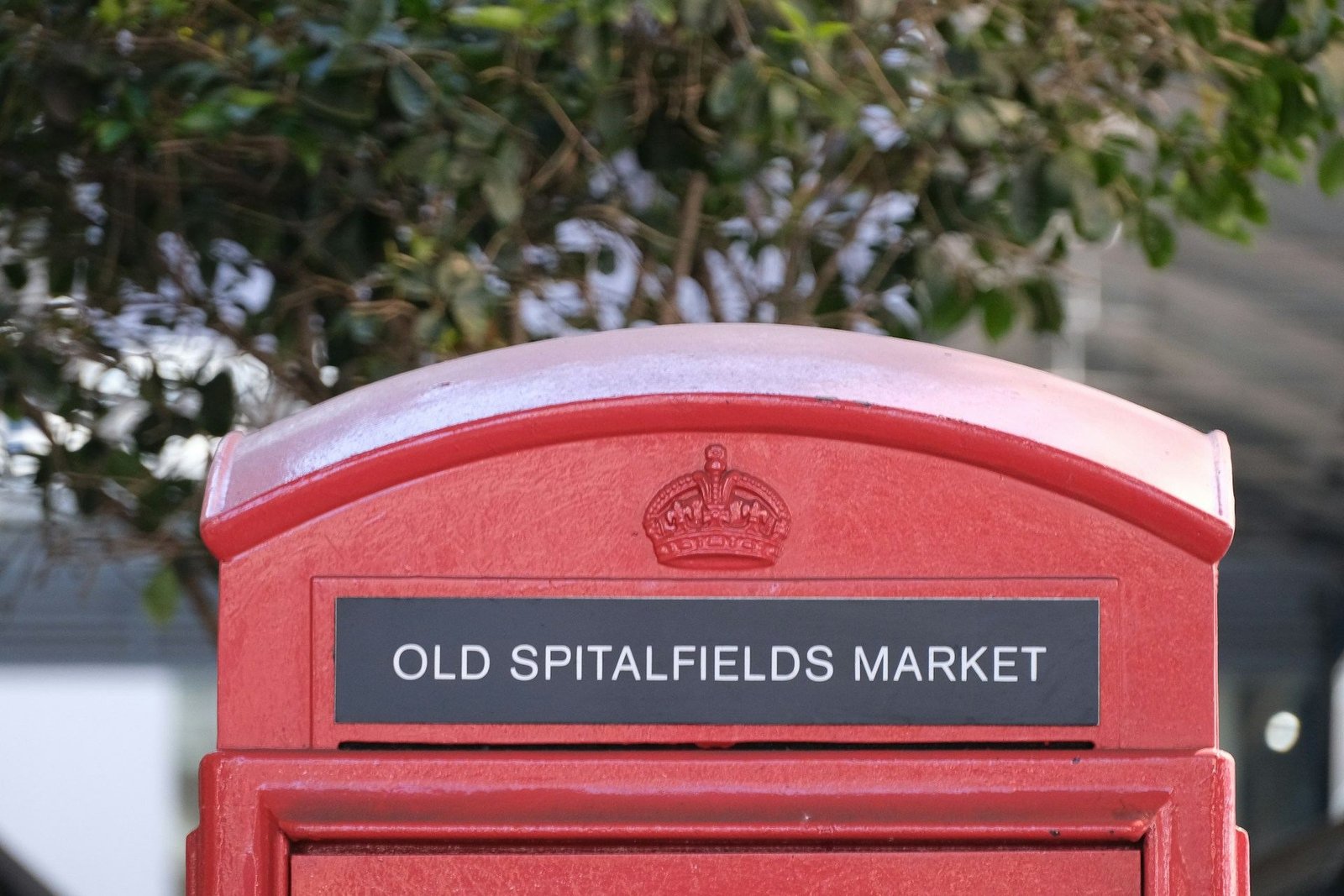 Red telephone box marked Old Spitalfields Market