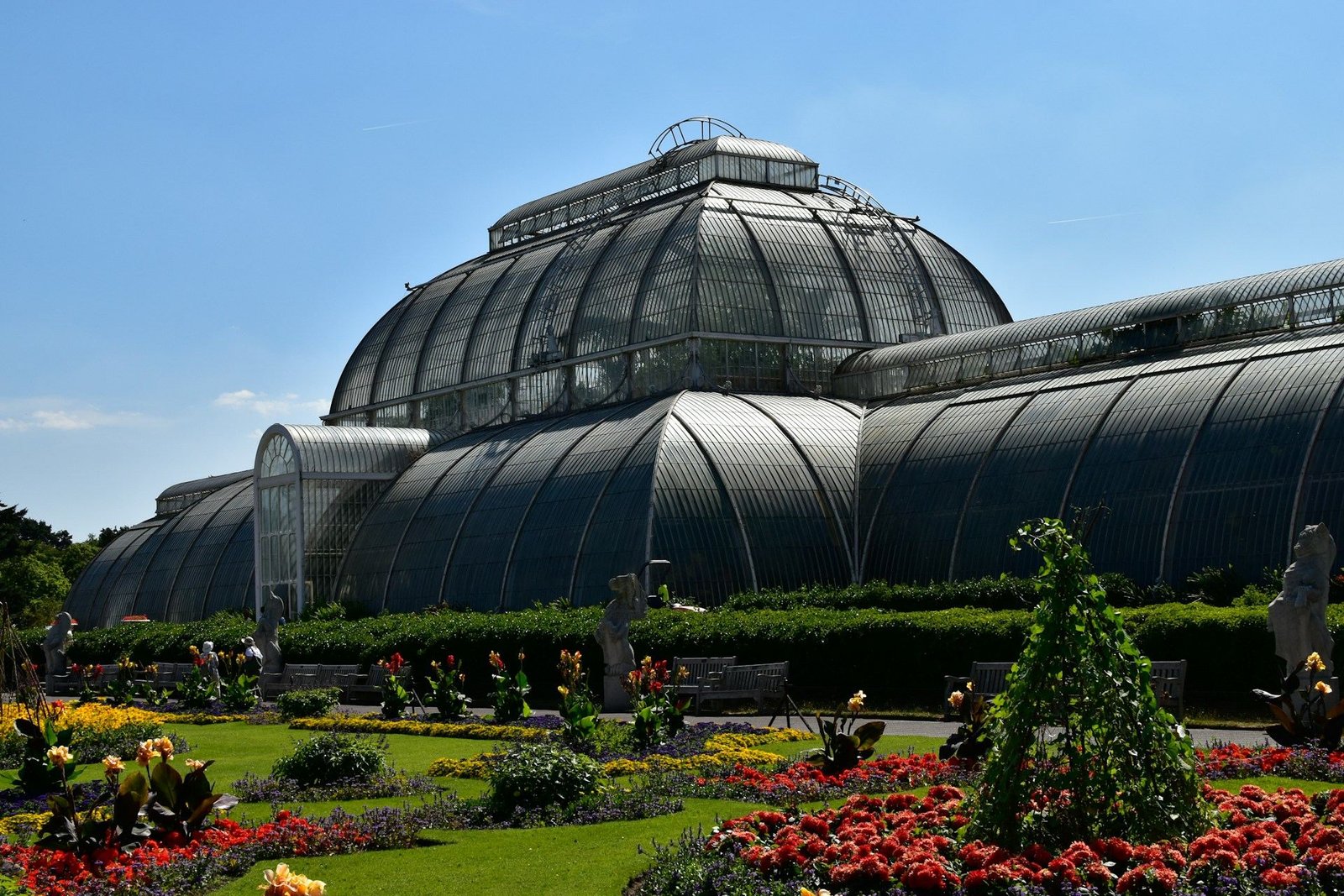 Palm House glasshouse and flower beds at Kew Gardens