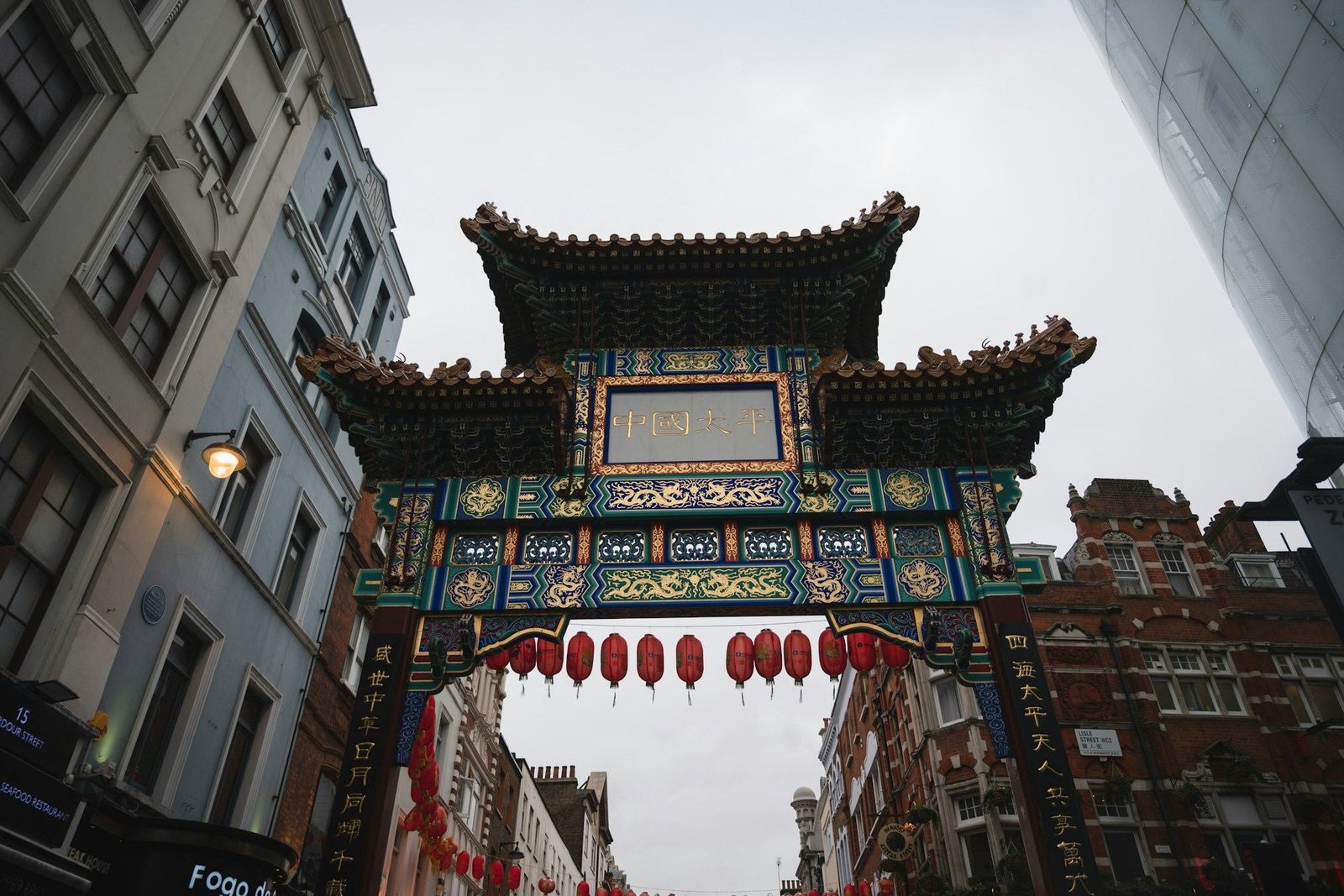 Chinatown gate with red lanterns near Soho