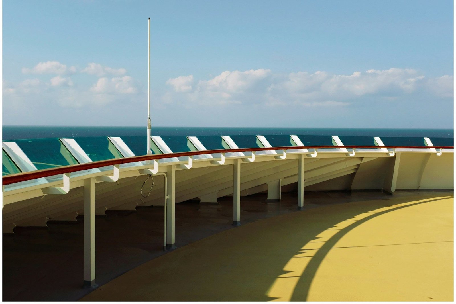 Curved outdoor deck of a cruise ship at sea