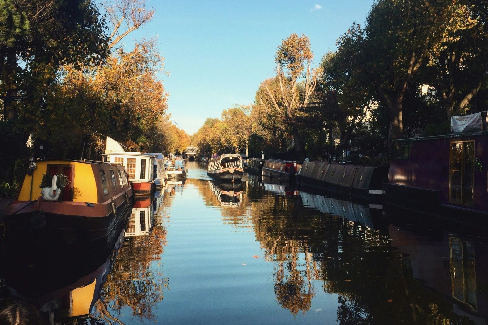 Narrowboats on the canal near Paddington in autumn