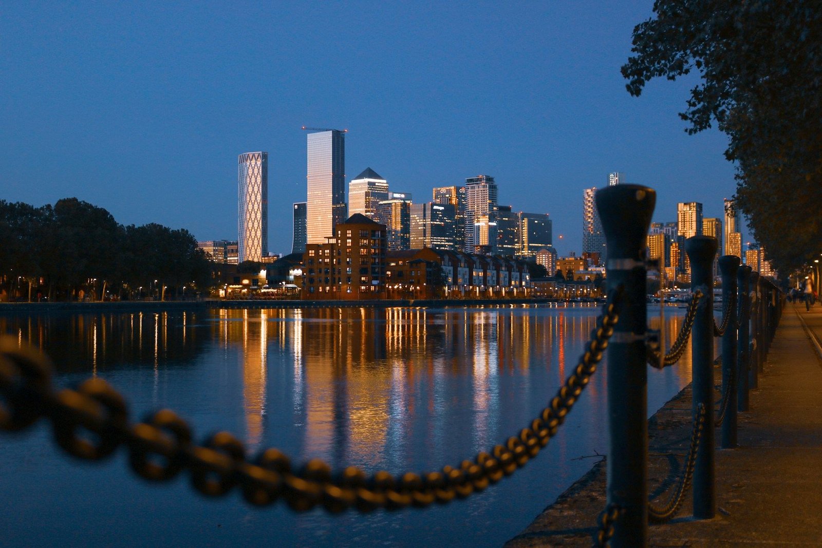 Canary Wharf skyline reflected in the Thames at night