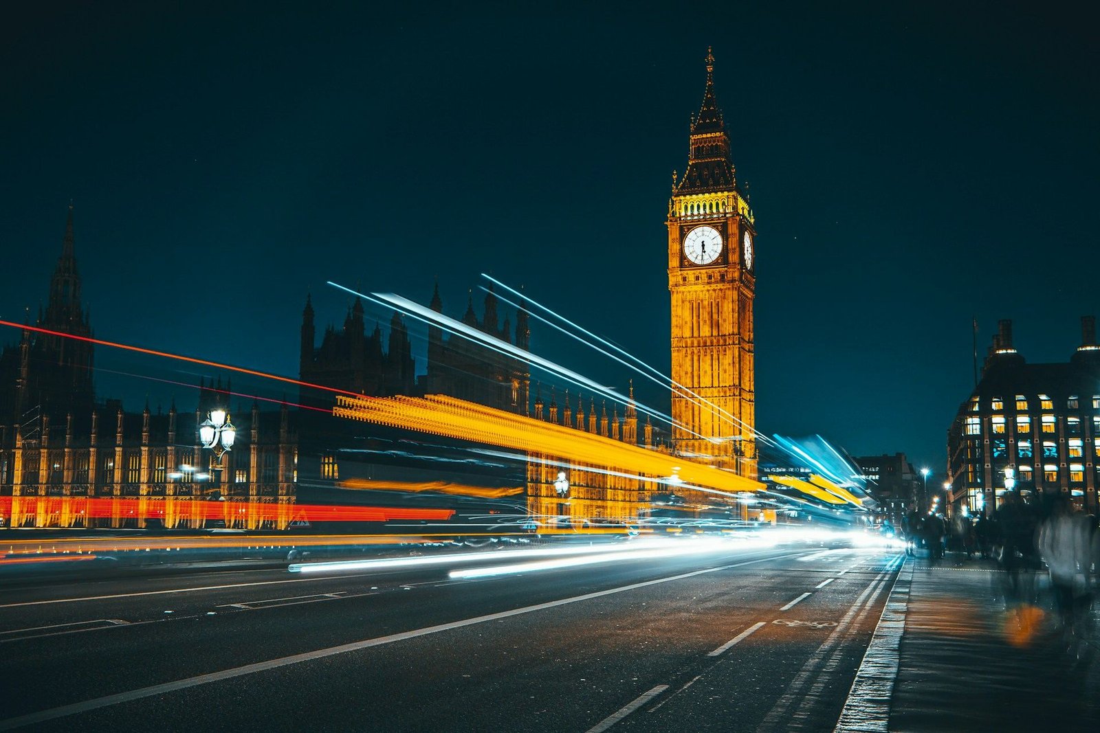 Light trails of traffic passing Big Ben at night