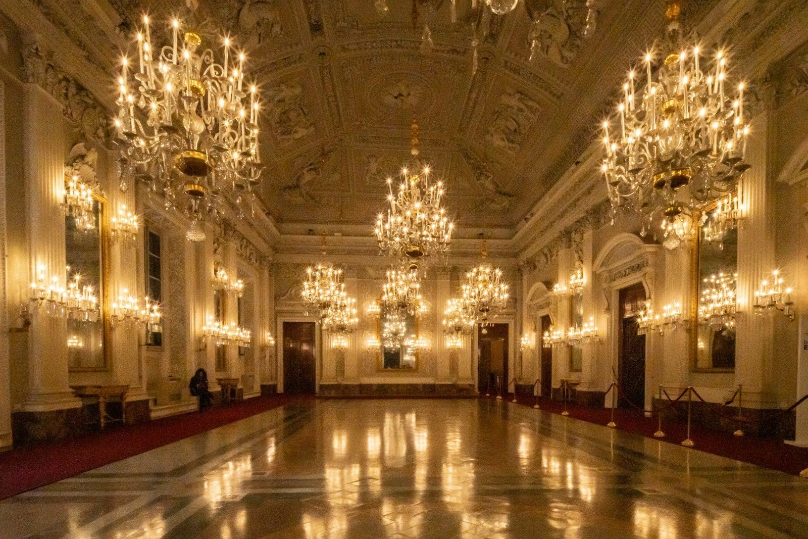Ballroom with crystal chandeliers and a polished floor